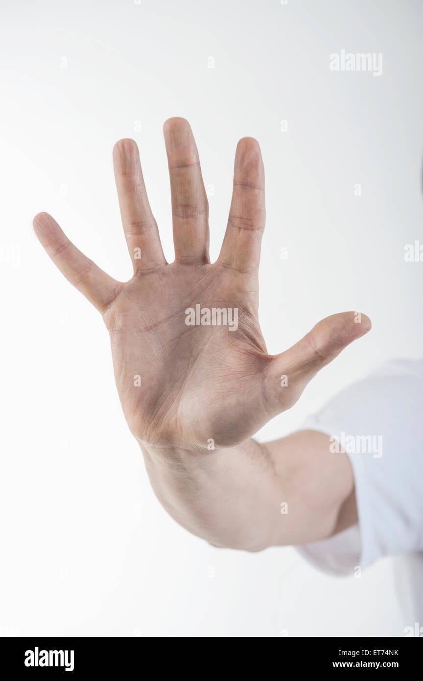 Close-up of man's hand making stop gesture, Bavaria, Germany Stock Photo