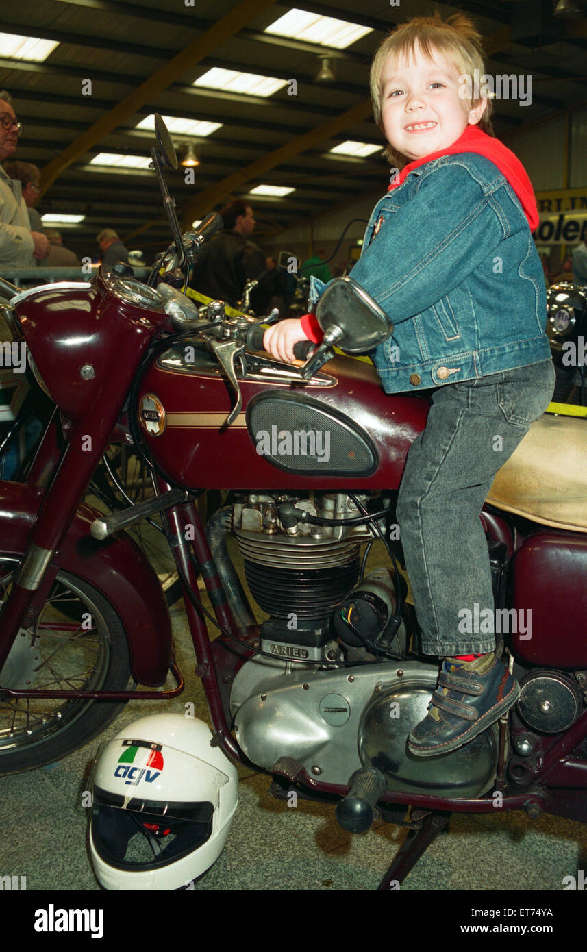 Michael Tilley, aged three and a half, tries out a 1956 Ariel 500cc at the Classic Bike Show. 28th March 1993. Stock Photo