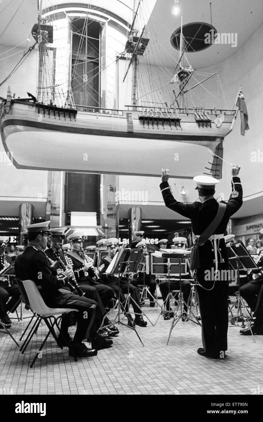 A band plays beneath a replica of Captain Cook's ship 'Endeavour' hanging in the Cleveland Centre. 18th July 1986. Stock Photo