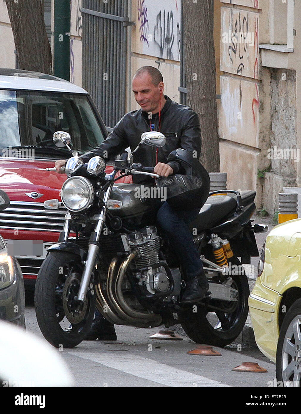 Yanis Varoufakis gets on his motorcycle parked near his home.  The Greek Finance Minister believes that a referendum could be held if a deal can not be reached on Greece's proposed debt renegotiation plans with the Eurozone. Greece will put its proposal to Eurozone ministers at a Eurogroup meeting in Brussels today (09Mar15).  Featuring: Yanis Varoufakis Where: Athens, Greece When: 08 Mar 2015 Credit: Papadakis Press/WENN.com  **Available for Publication in UK, USA, Germany, Austria, Switzerland, France, Spain** Stock Photo