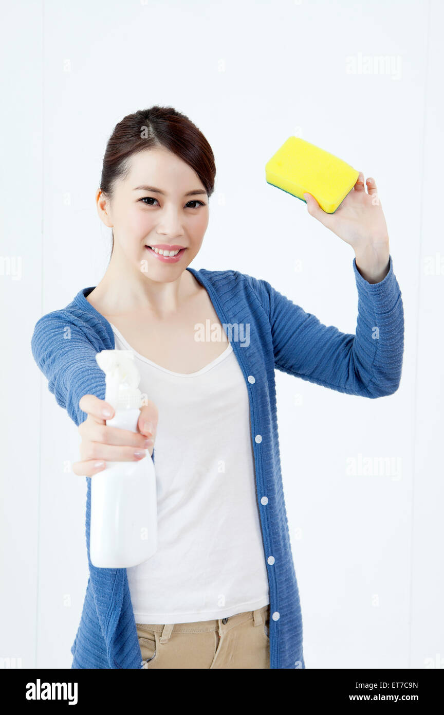 Woman looking at cleaning products hires stock photography and images