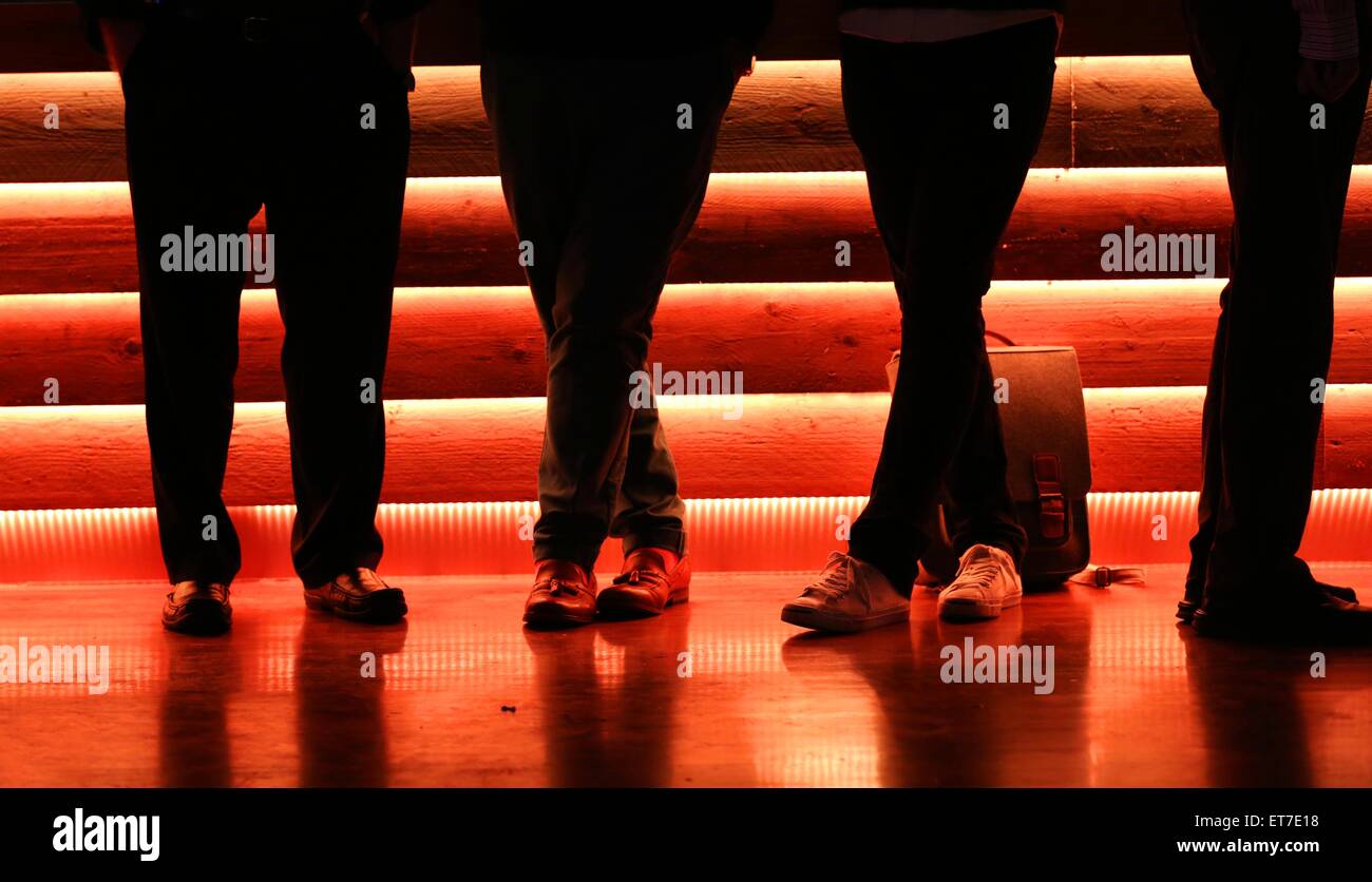 Drinkers standing at the bar. Picture by James Boardman. Stock Photo