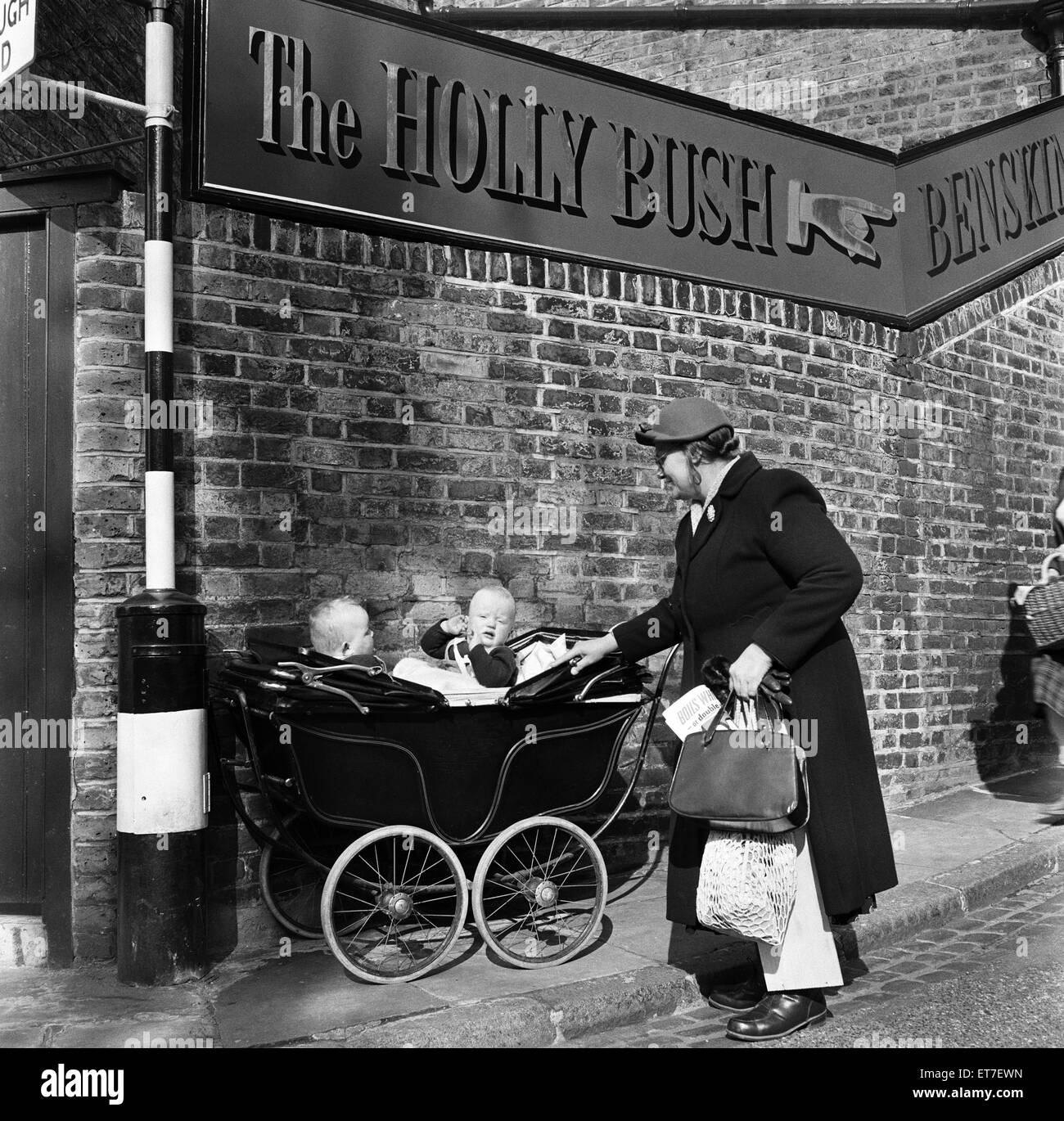 Twins in a pram on Holly Hill in Hampstead, North London. April 1954. Stock Photo