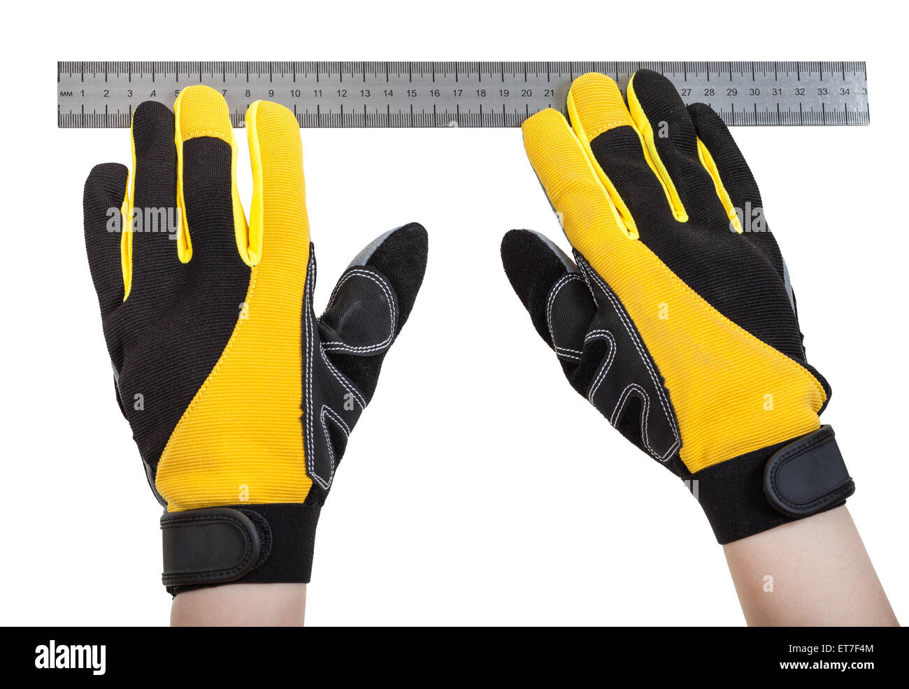 builder hands in safety gloves with ruler isolated on white background ...