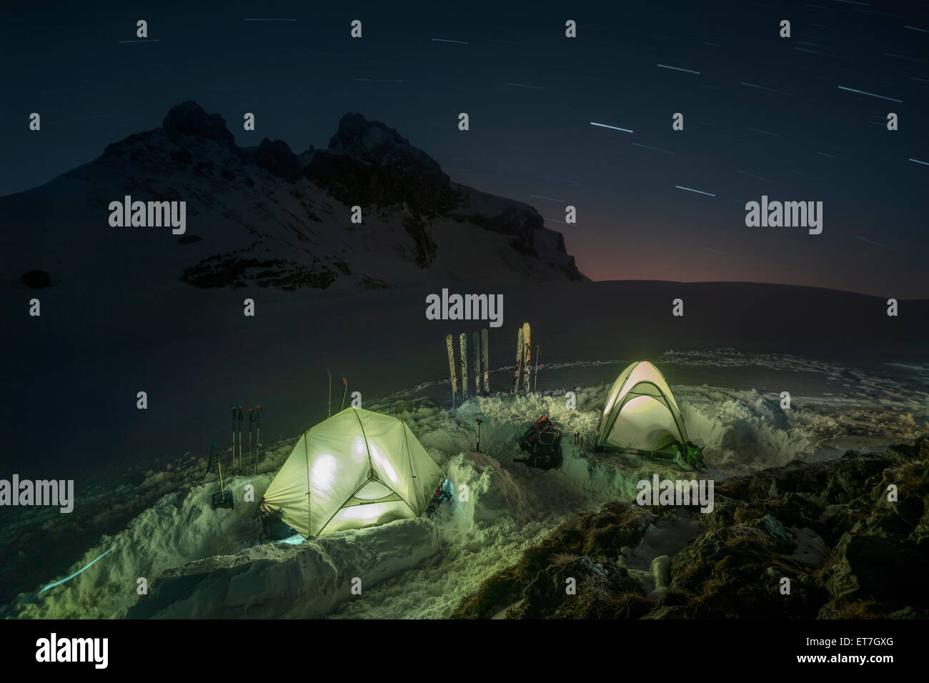 Tents lit up at night in the snow, Tyrol, Austria Stock Photo