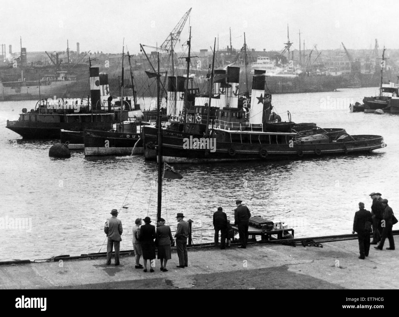 Tugboats of the France, Fenwick company of Tyne and Wear pictured at their moorings off South Shields. Following company tradition, they all fly their flags at half mast in tribute to the late skipper of the Criccieth, Captain John McCarrick. 6th July 194 Stock Photo