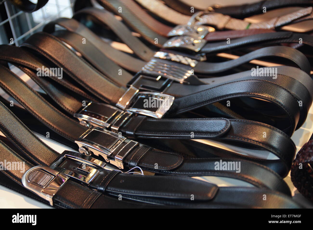 Collection Of Leather Belts On A Wooden Table Stock Photo - Download Image  Now - Belt, Men, Leather - iStock