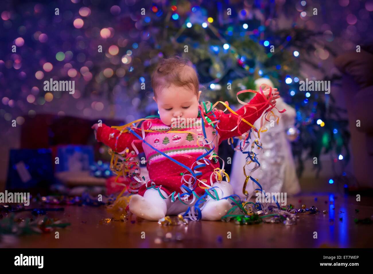 Baby under Christmas tree Stock Photo Alamy