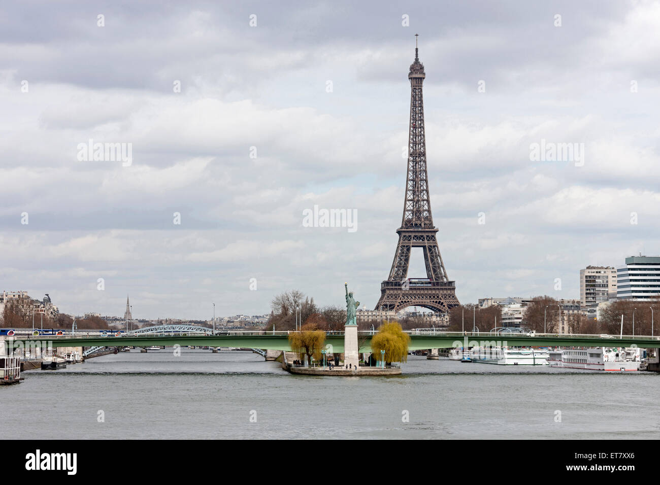 Replica of Statue of Liberty near Pont Grenelle with Eiffel Tower in background, Paris, France Stock Photo