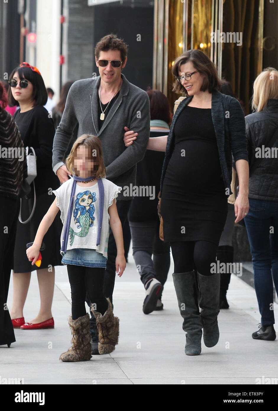Pregnant Milla Jovovich spotted out with her husband Paul W. S