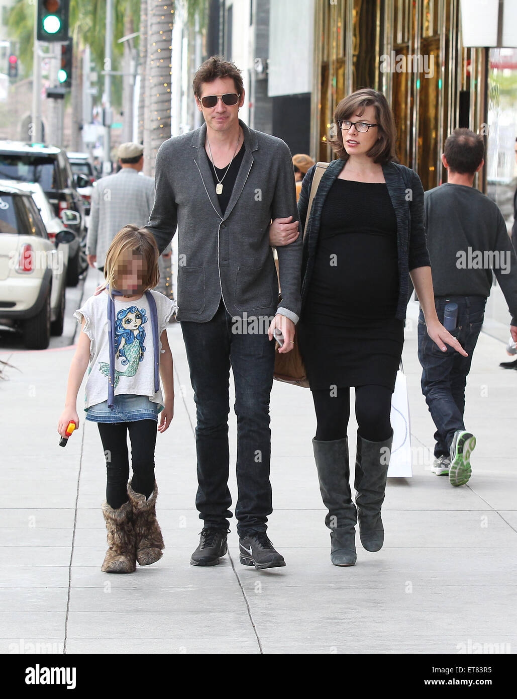 Pregnant Milla Jovovich spotted out with her husband Paul W. S ...