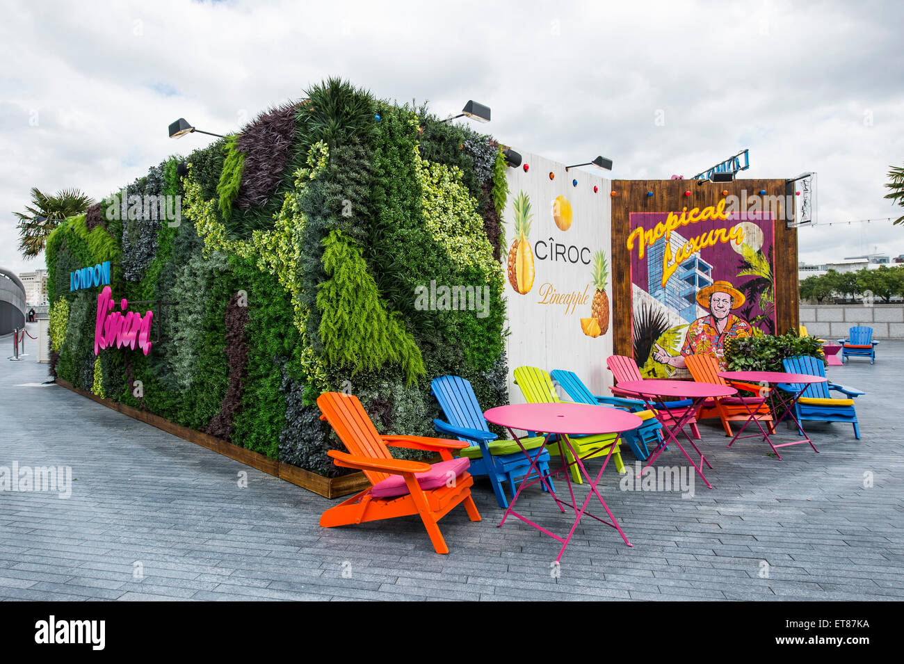 London Riviera pop up cafe next to City Hall in London with brightly  coloured furniture Stock Photo - Alamy