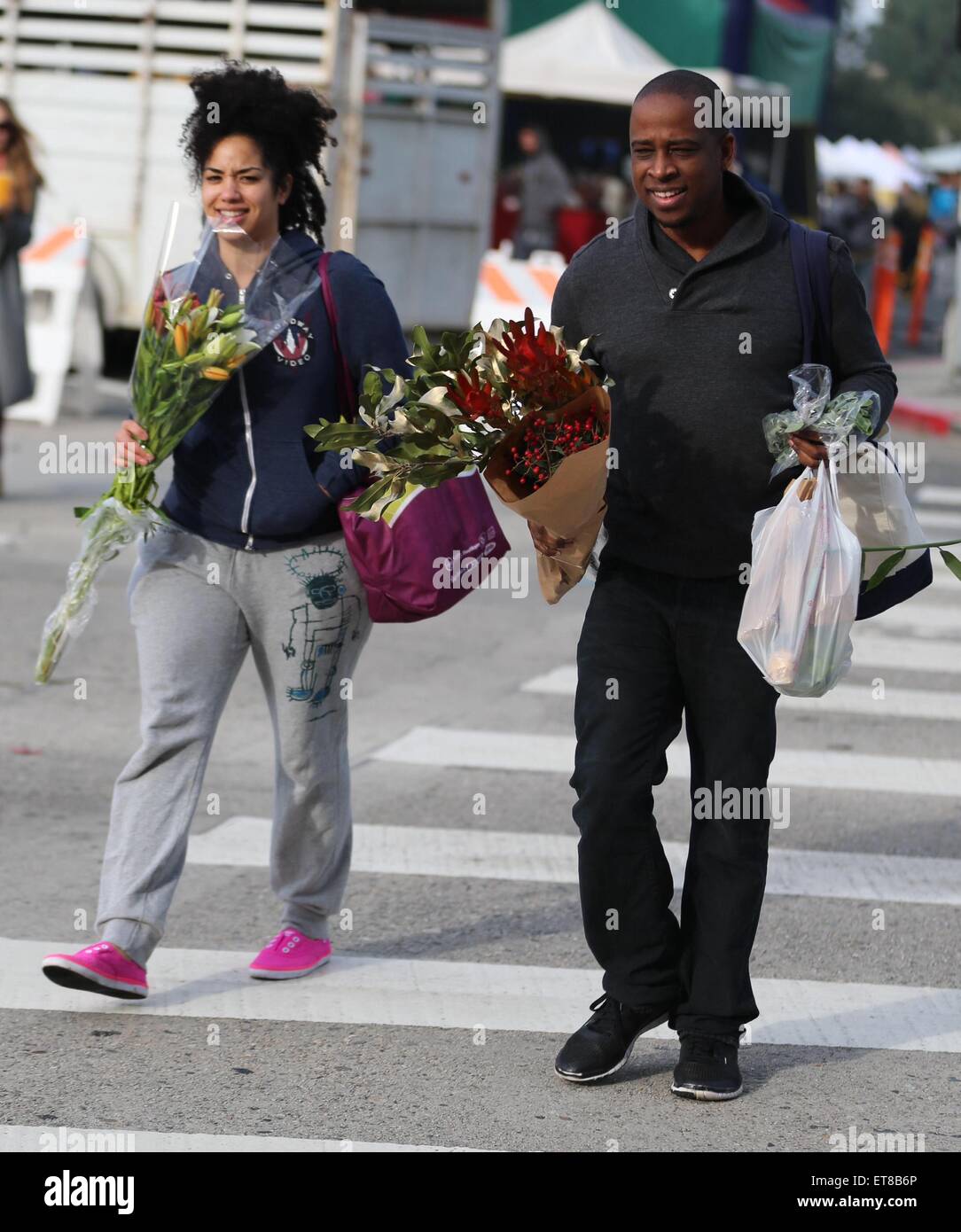 Keith Powell and his wife, Jill Knox purchase flowers from the Farmer's