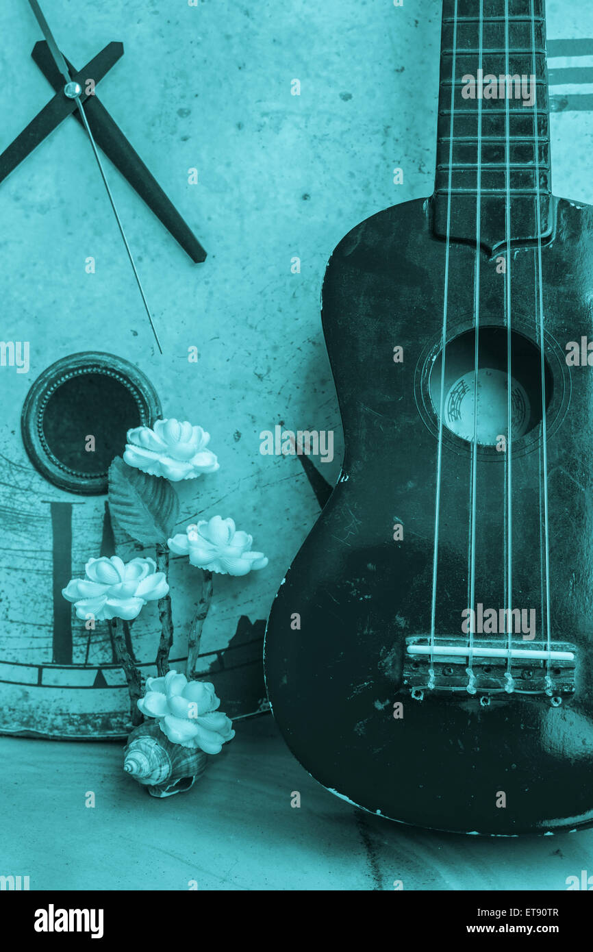 Ukulele and clock on a black and white background Stock Photo Alamy