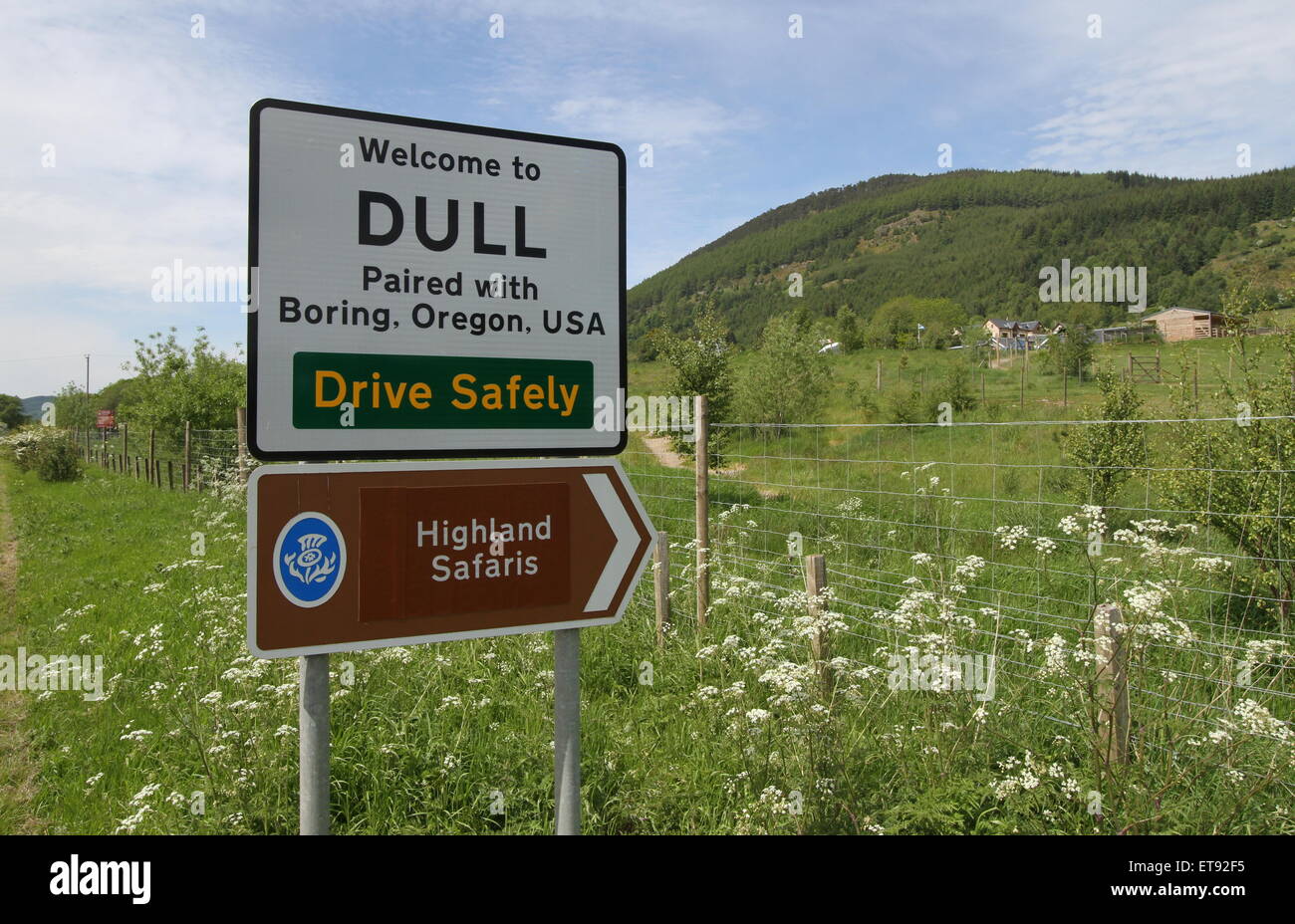 Welcome to Dull paired with Boring, Oregon sign Scotland June 2015 Stock Photo