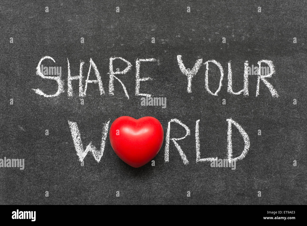 share your world phrase handwritten on blackboard with heart symbol instead of O Stock Photo