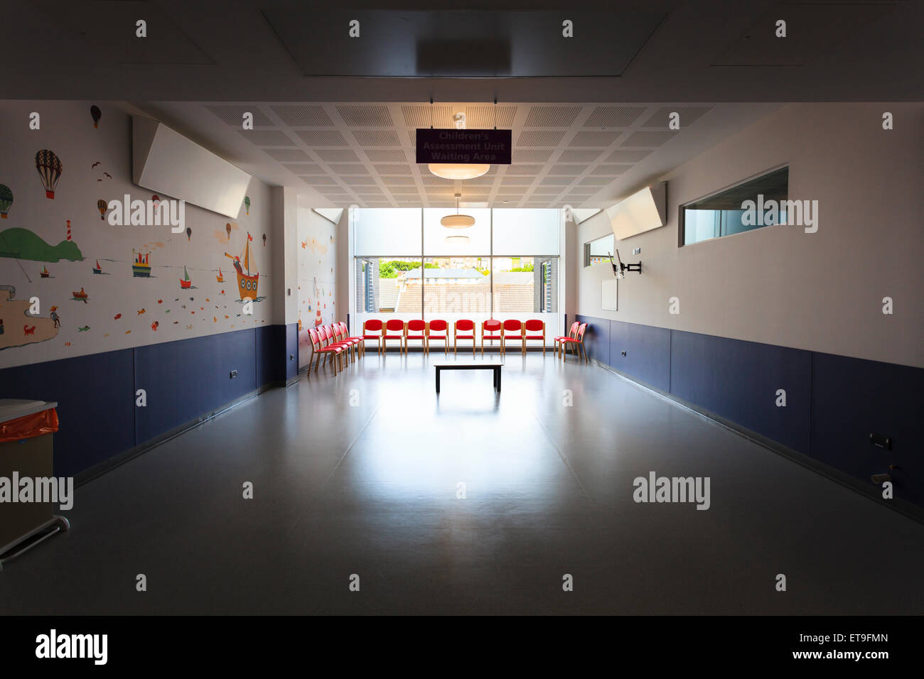 Unoccupied hospital childrens waiting without people and few chairs Stock Photo