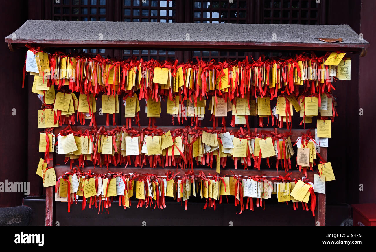 Paper prayers and wishes in the  The Shanghai Wen Miao - Shanghai Confucian Temple is an ancient temple  ( 700 years of history ) was built to pay homage to Confucius China ( Confucius 551–479 BC Chinese teacher, editor, politician, and philosopher ) Stock Photo