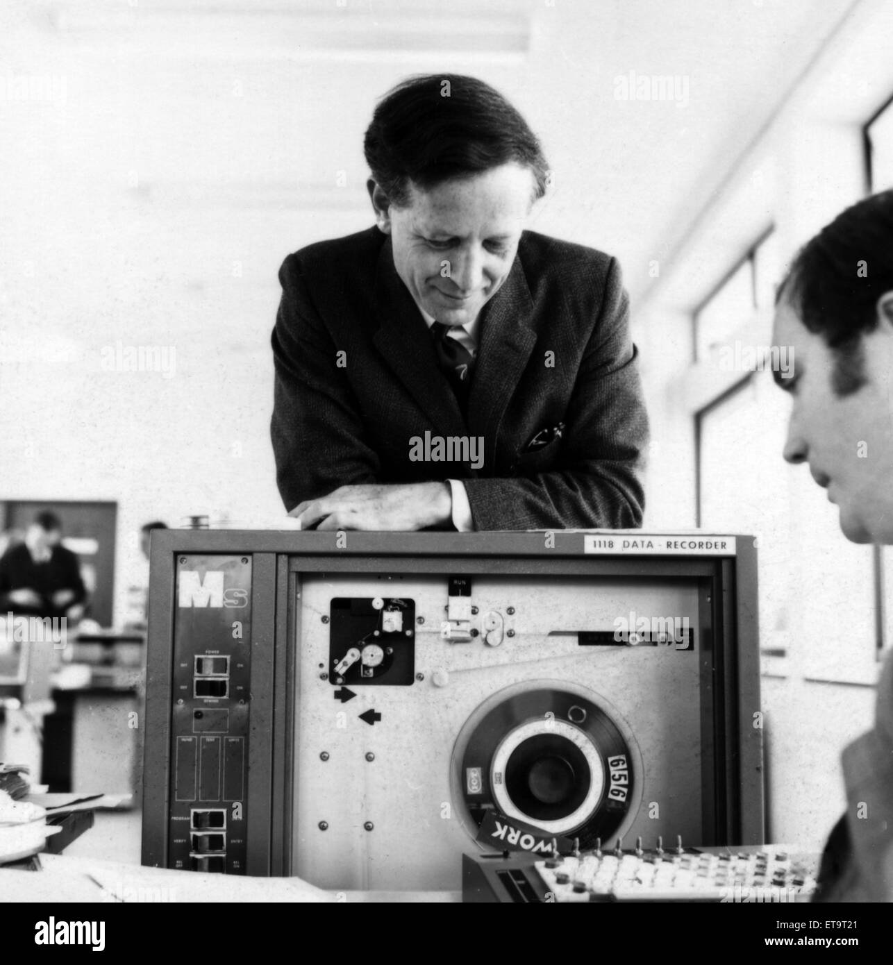 Stan Kelly-Bootle, author, songwriter and known for chieving the first postgraduate diploma in computer science (1954), born 1929, died 16th April 2014. Pictured, computing the mistake spotters entries. 1st August 1969. Stock Photo