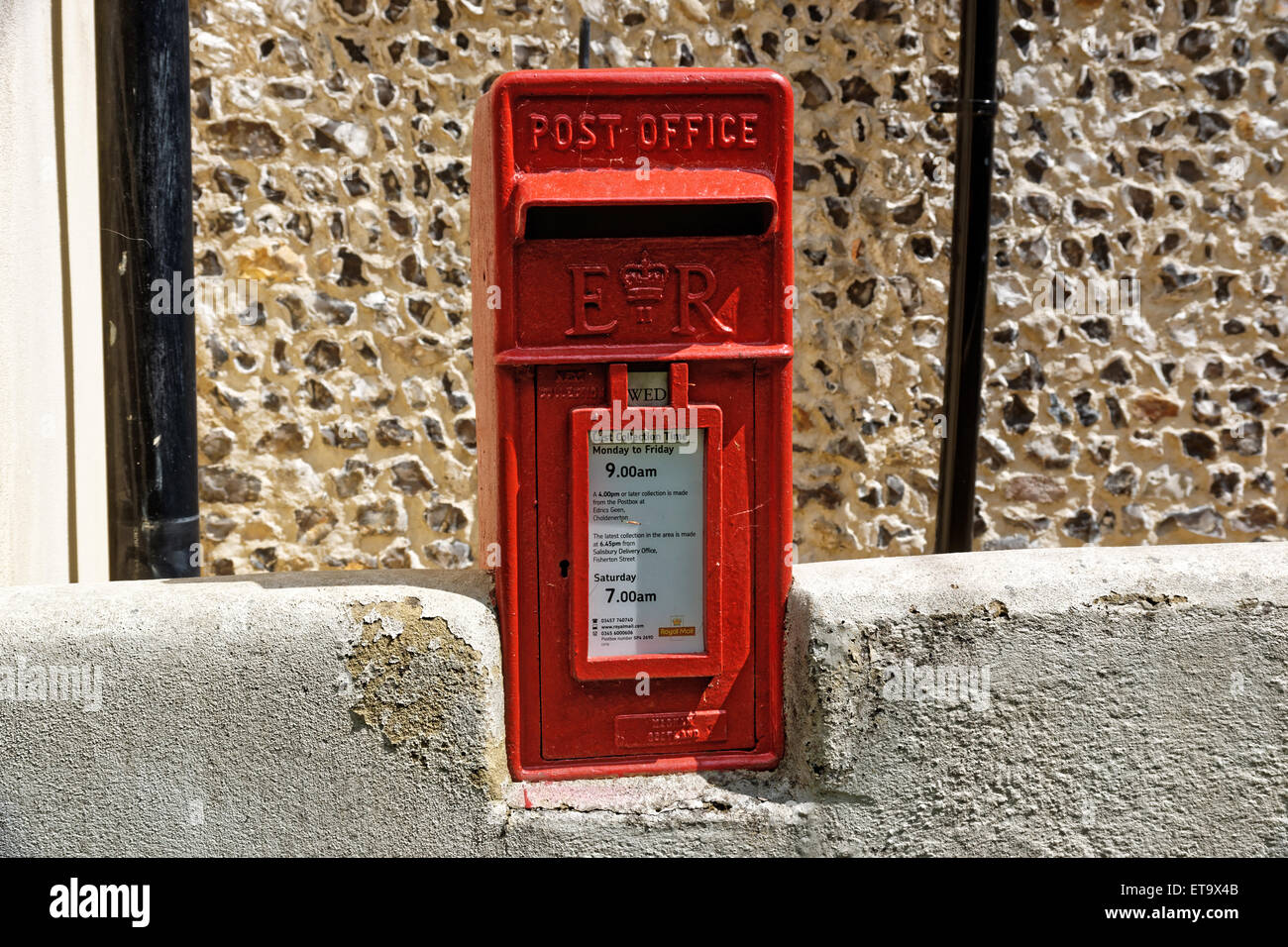 Red mail box in wall. Stock Photo