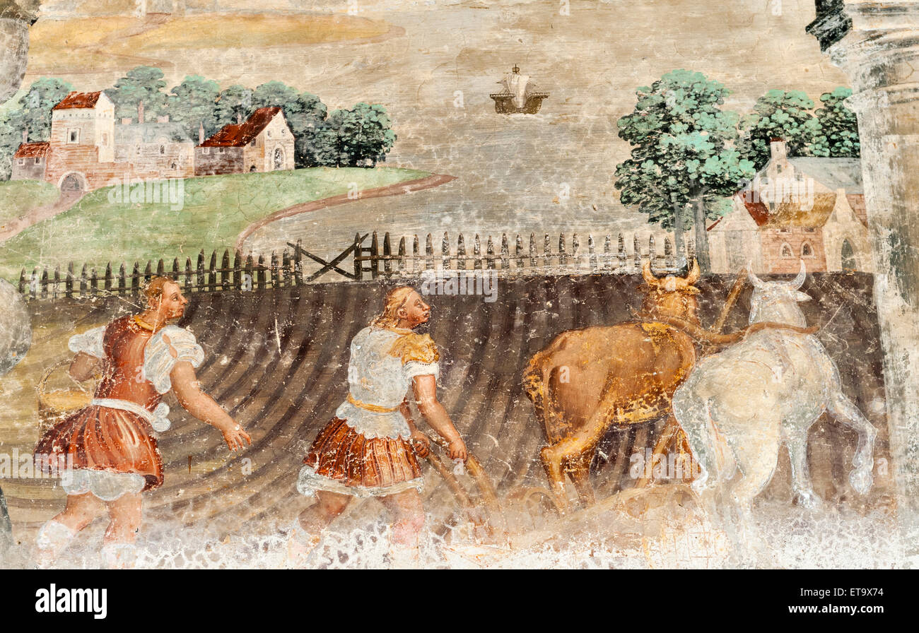 Villa Cicogna Mozzoni, Bisuschio, Lombardy, Northern Italy. Early 16c fresco of farmers ploughing a field with oxen Stock Photo