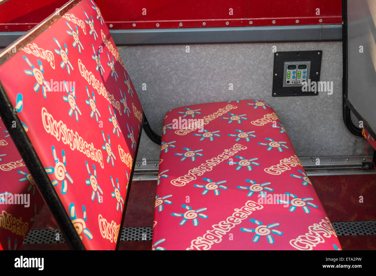 City sightseeing tour bus seat, and audio headphone socket for listening to tour commentary. Stock Photo
