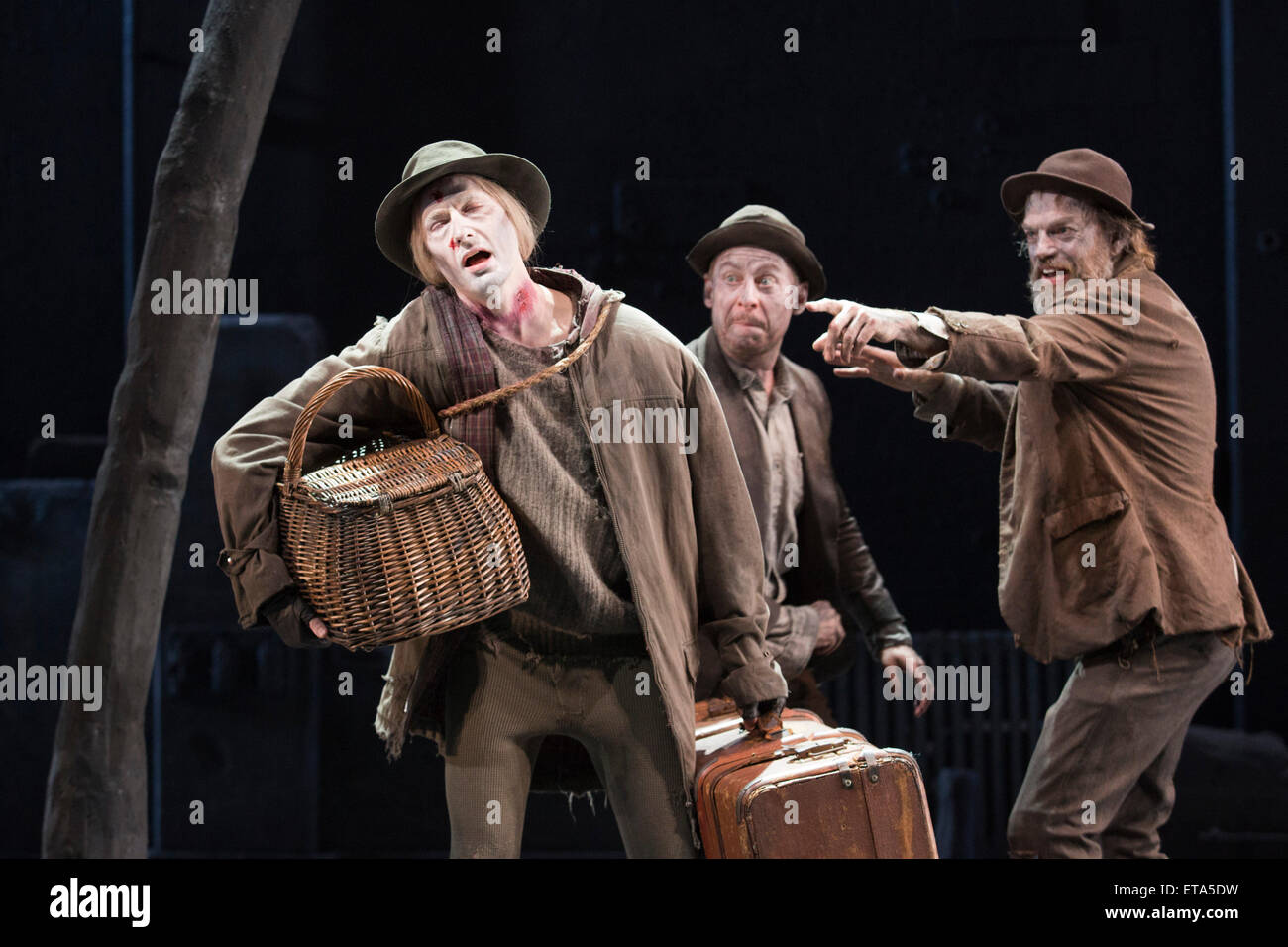 L-R: Luke Mullins as Lucky, Richard Rockburgh as Estragon and Hugo Weaving as Vladimir. Actors Richard Roxburgh and Hugo Weaving star in Samuel Beckett's 'Waiting for Godot' at the Barbican Theatre. Part of the International Beckett Season, this Sydney Theatre Company play is directed by Andrew Upton. With Luke Mullins as Luke, Philip Quast as Pozzo, Richard Roxburgh as Estragon and Hugo Weaving as Vladimir. Performances from 4 to 13 June 2015 at the Barbican Theatre. Stock Photo