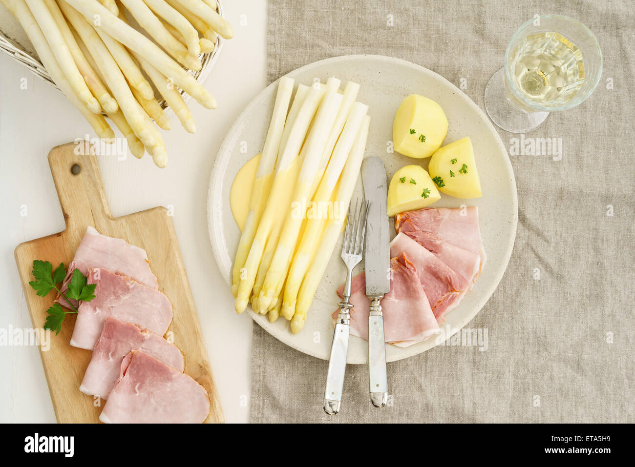 White asparagus with potatoes, boiled ham and hollandaise sauce Stock
