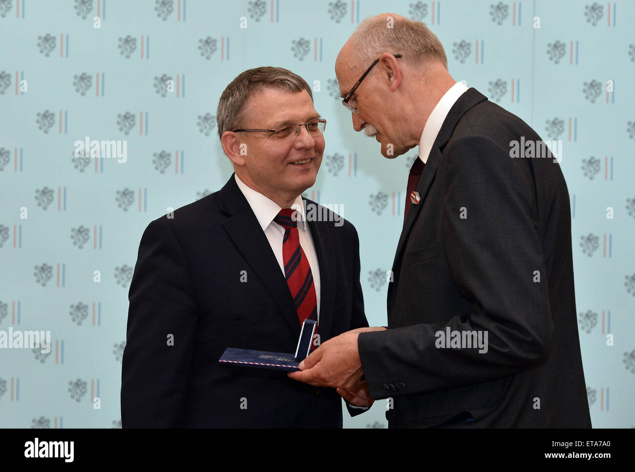 Foreign Minister Lubomir Zaoralek, left, decorates Latvian Bohemian studies scholar Janis Krastins with the annual Gratias Agit prize for spreading the good name of the Czech Republic abroad today, on Friday, June 12, 2015, in Prague, Czech Republic. (CTK Photo/Katerina Sulova) Stock Photo