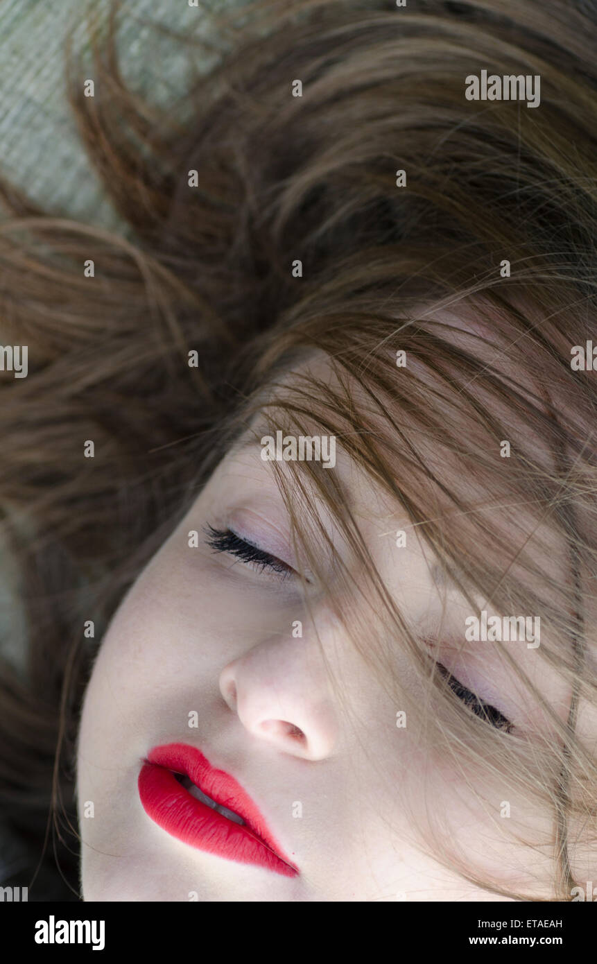 Beautiful young woman eyes closed Stock Photo - Alamy