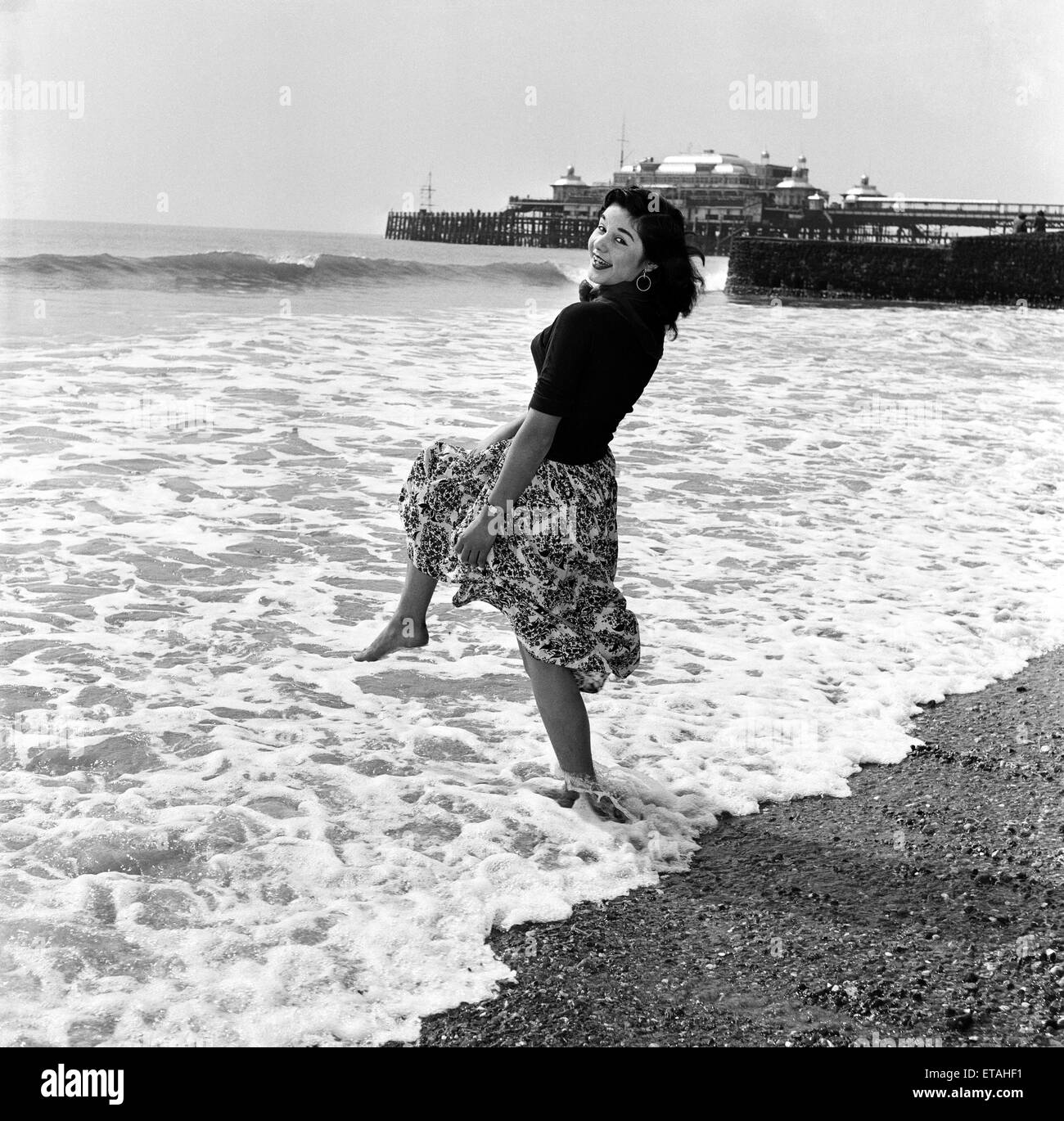 Muriel Harvey paddling in the sea at Brighton, East Sussex. 13th April 1954. Stock Photo