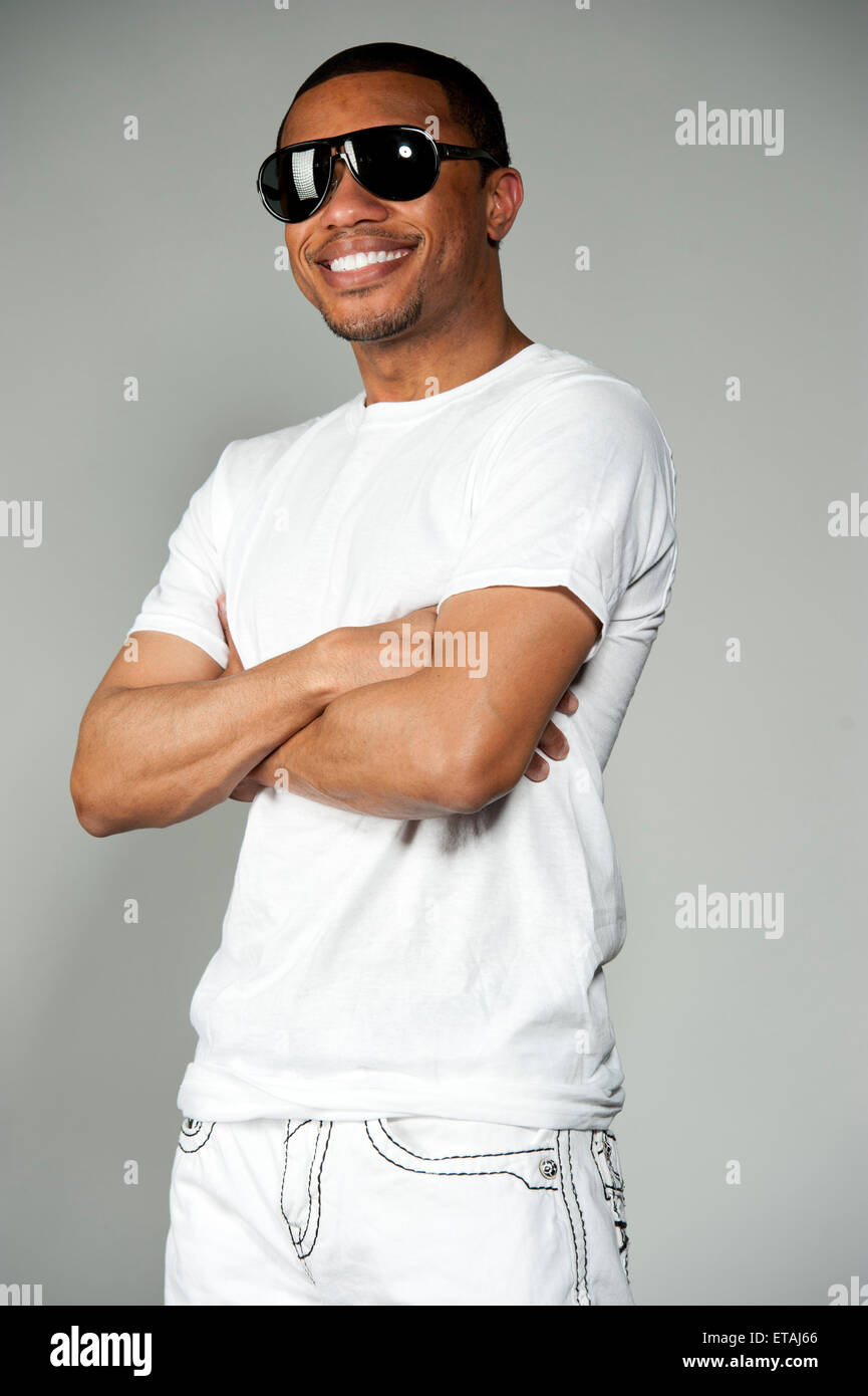 Happy black man white shirt hi-res stock photography and images - Alamy