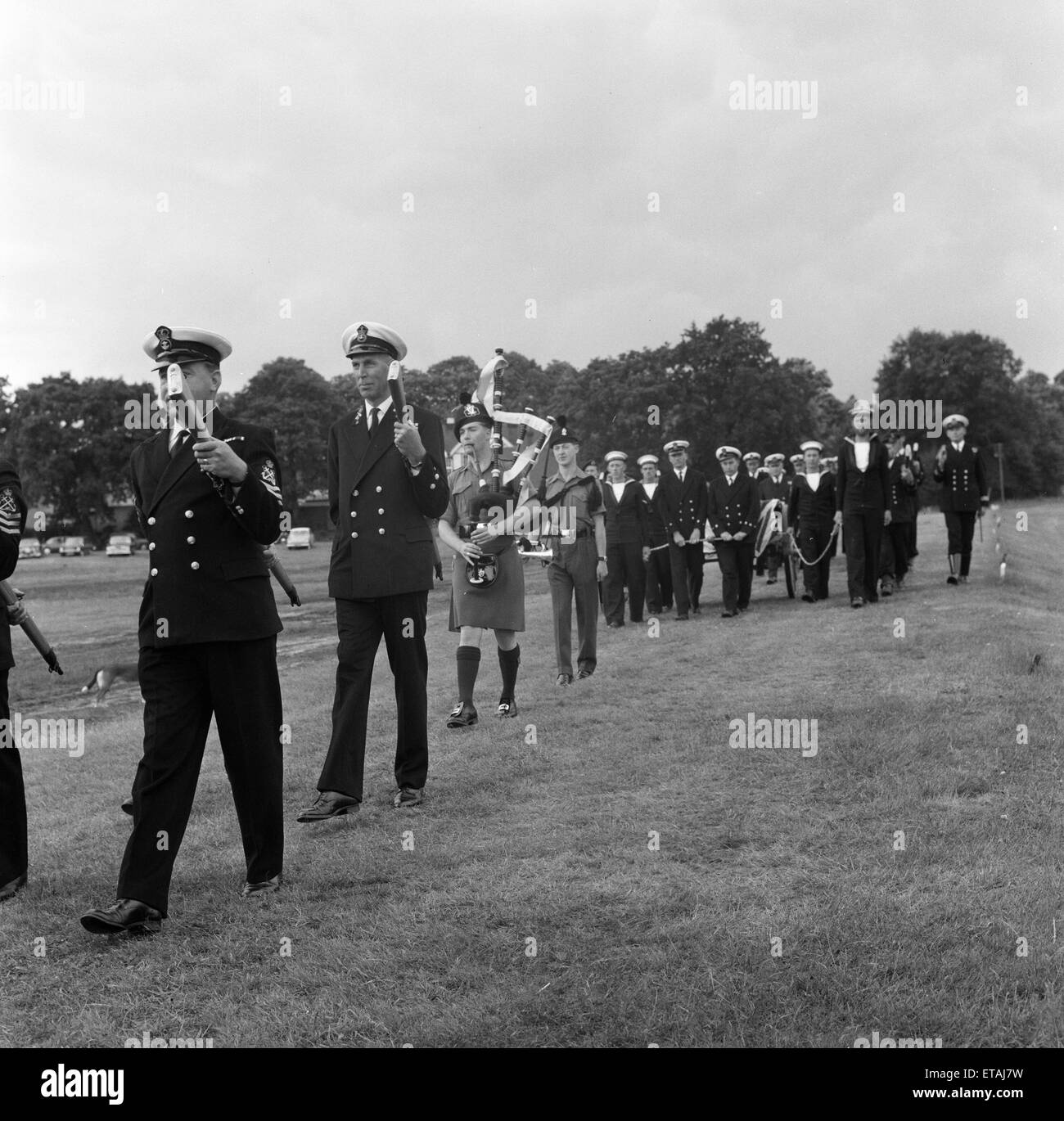 Lee-Enfield Rifle No. 4, buried with full military honours at Bisley, Surrey, England, by a 26 strong party of Royal Navy Officers and Men, Thursday 7th July 1966. Pictured, The burial party is piped to the graveside at Bisley. Stock Photo