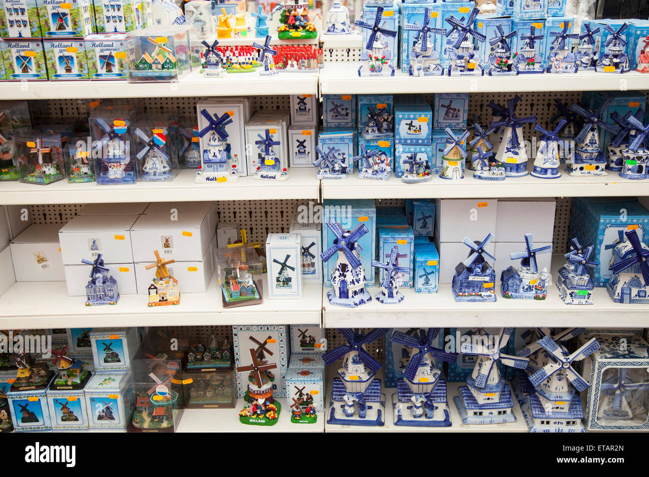 delft blue windmills and other souvenirs on shelves in amsterdam shop Stock Photo
