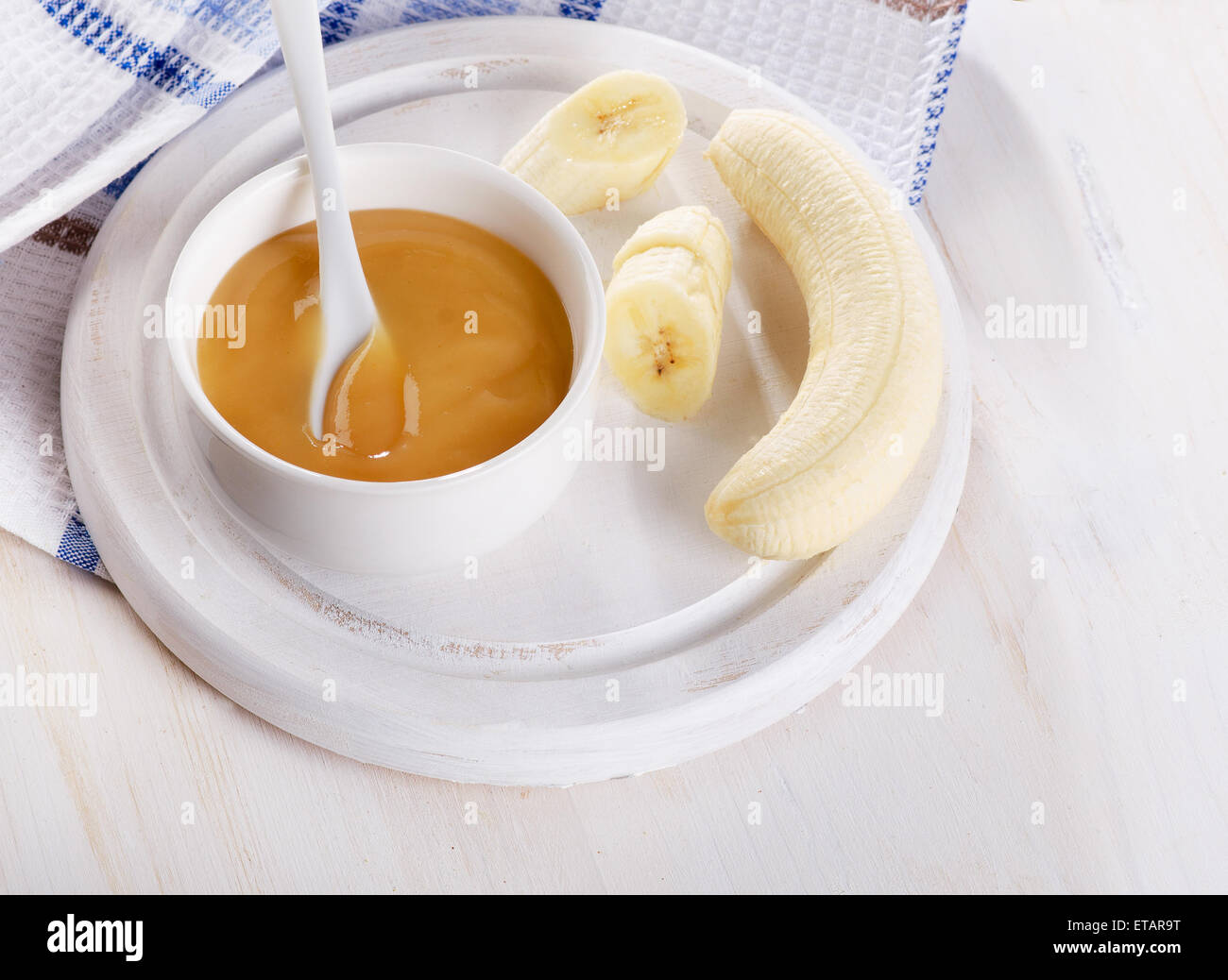 Baby food - bananas puree in bowl. Selective focus Stock Photo