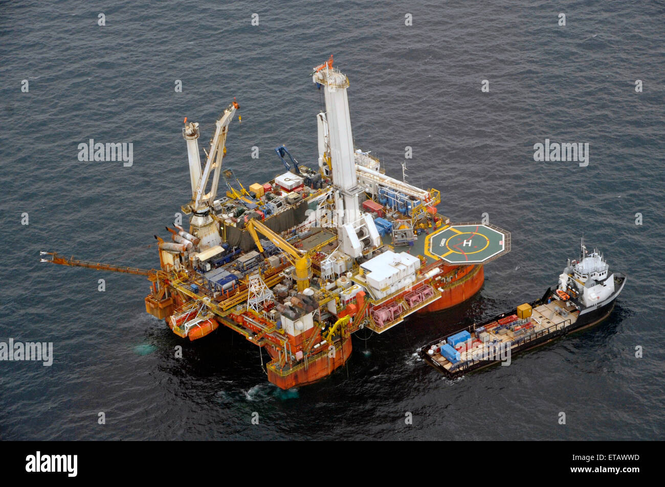 The mobile offshore drilling unit Q-4000 in the process of drilling a relief well prepares for Tropical Storm Bonnie at the BP Deepwater Horizon oil spill disaster site July 23, 2010 in the Gulf of Mexico. Stock Photo
