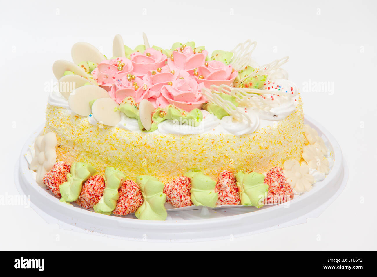 the big sweet pie decorated with cream roses on white background Stock Photo