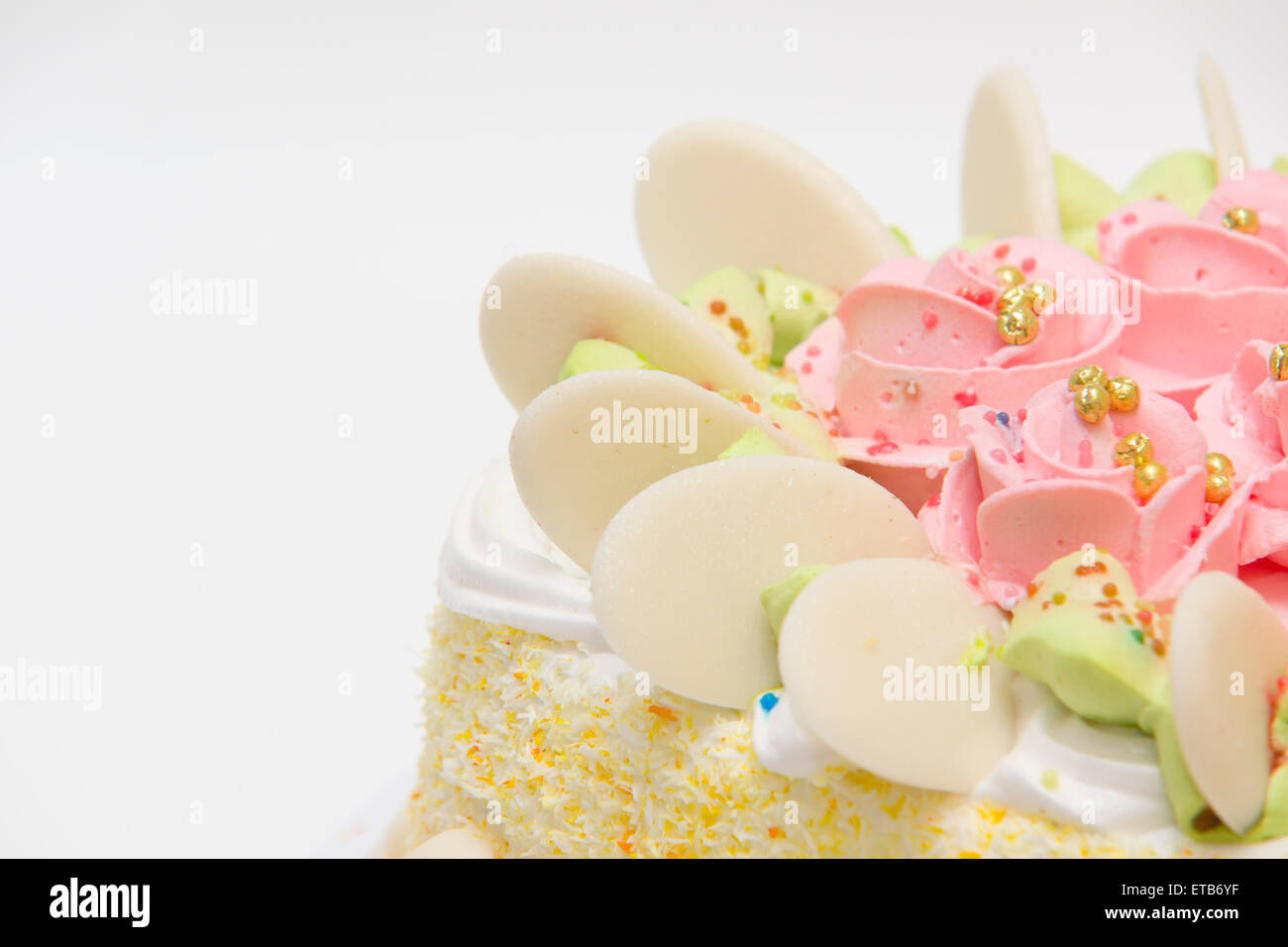 the big sweet pie decorated with cream roses on white background Stock Photo