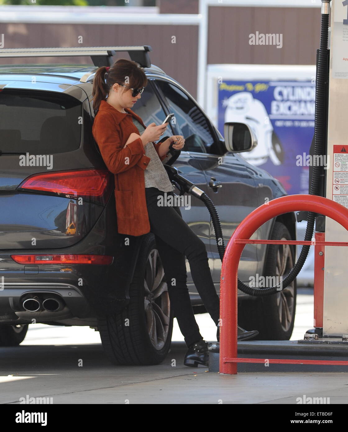 'Fifty Shades of Grey' star Dakota Johnson is all smiles after picking up her dry cleaning in Los Angeles. Afterwards, the actress headed out for lunch to Homestate cafe with a male friend  Featuring: Dakota Johnson Where: Los Angeles, California, United States When: 14 Jan 2015 Credit: Cousart/JFXimages/WENN.com Stock Photo