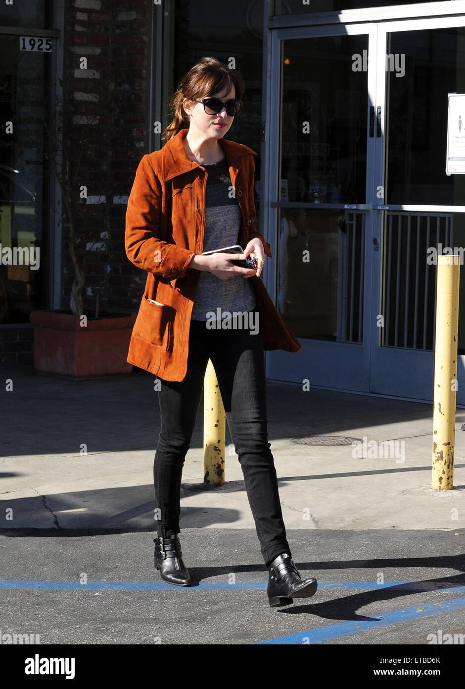 'Fifty Shades of Grey' star Dakota Johnson is all smiles after picking up her dry cleaning in Los Angeles. Afterwards, the actress headed out for lunch to Homestate cafe with a male friend  Featuring: Dakota Johnson Where: Los Angeles, California, United States When: 14 Jan 2015 Credit: Cousart/JFXimages/WENN.com Stock Photo