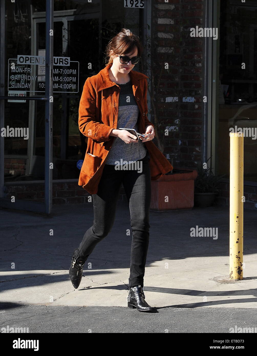 'Fifty Shades of Grey' star Dakota Johnson is all smiles after picking up her dry cleaning in Los Angeles. Afterwards, the actress headed out for lunch to Homestate cafe with a male friend  Featuring: Dakota Johnson Where: Los Angeles, California, United States When: 14 Jan 2015 Credit: Cousart/JFXimages/WENN.com Stock Photo