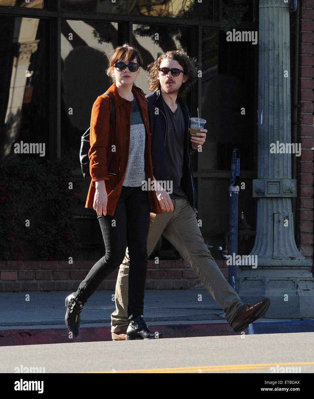 'Fifty Shades of Grey' star Dakota Johnson is all smiles after picking up her dry cleaning in Los Angeles. Afterwards, the actress headed out for lunch to Homestate cafe with a male friend  Featuring: Dakota Johnson Where: Los Angeles, California, United States When: 14 Jan 2015 Credit: Cousart/JFXimages/WENN.com Stock Photo