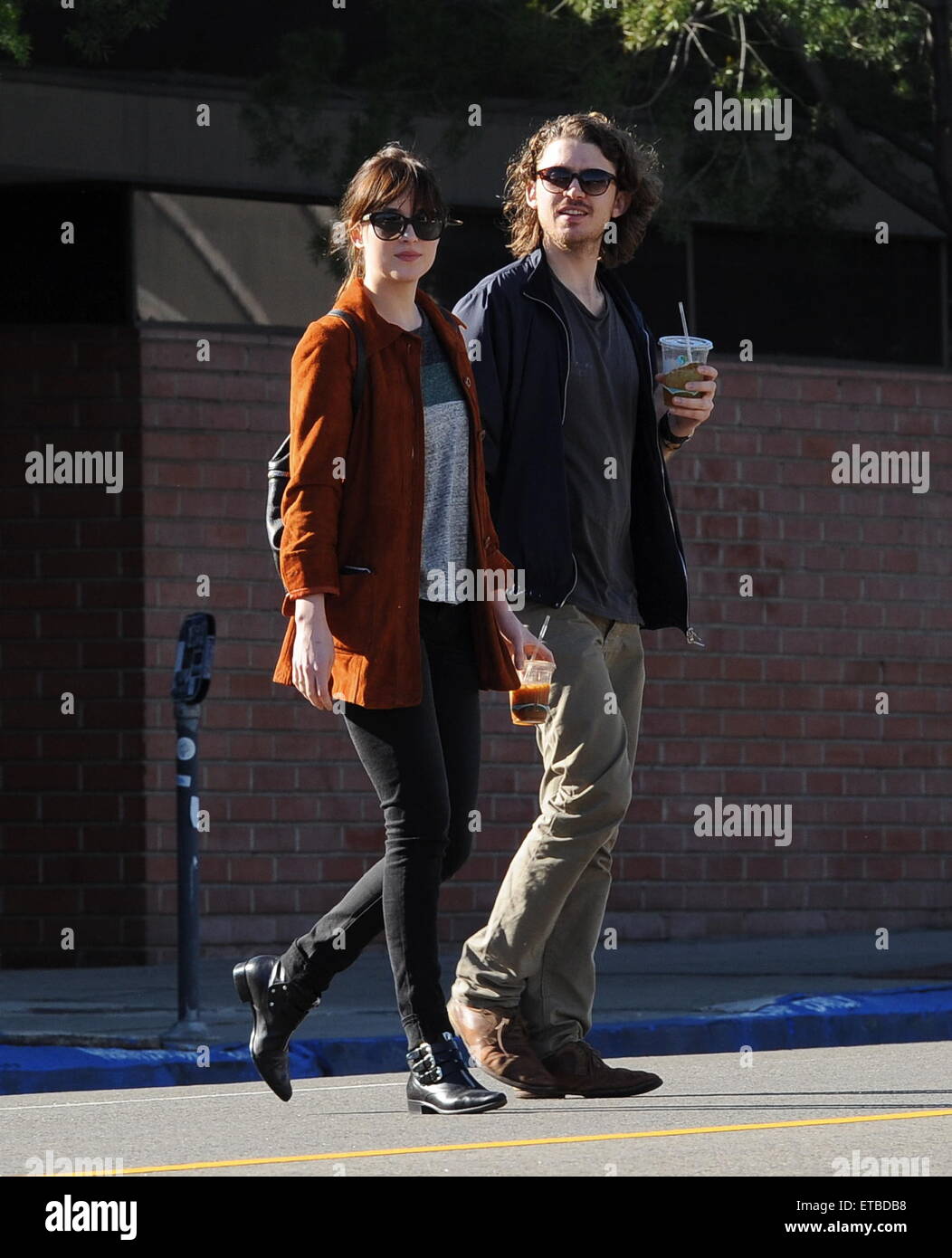 'Fifty Shades of Grey' star Dakota Johnson is all smiles after picking up her dry cleaning in Los Angeles. Afterwards, the actress headed out for lunch to Homestate cafe with a male friend  Featuring: Dakota Johnson Where: Los Angeles, California, United States When: 14 Jan 2015 Credit: Cousart/JFXimages/WENN.com Stock Photo