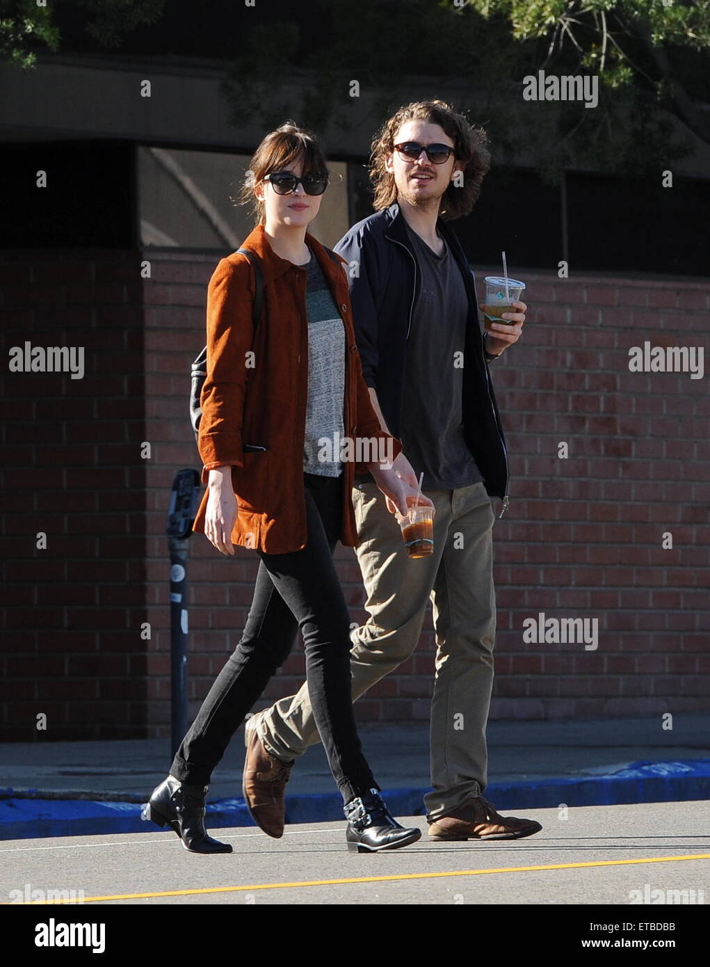 'Fifty Shades of Grey' star Dakota Johnson is all smiles after picking up her dry cleaning in Los Angeles. Afterwards, the actress headed out for lunch to Homestate cafe with a male friend  Featuring: Dakota Johnson Where: Los Angeles, California, United States When: 14 Jan 2015 Credit: Cousart/JFXimages/WENN.com Stock Photo