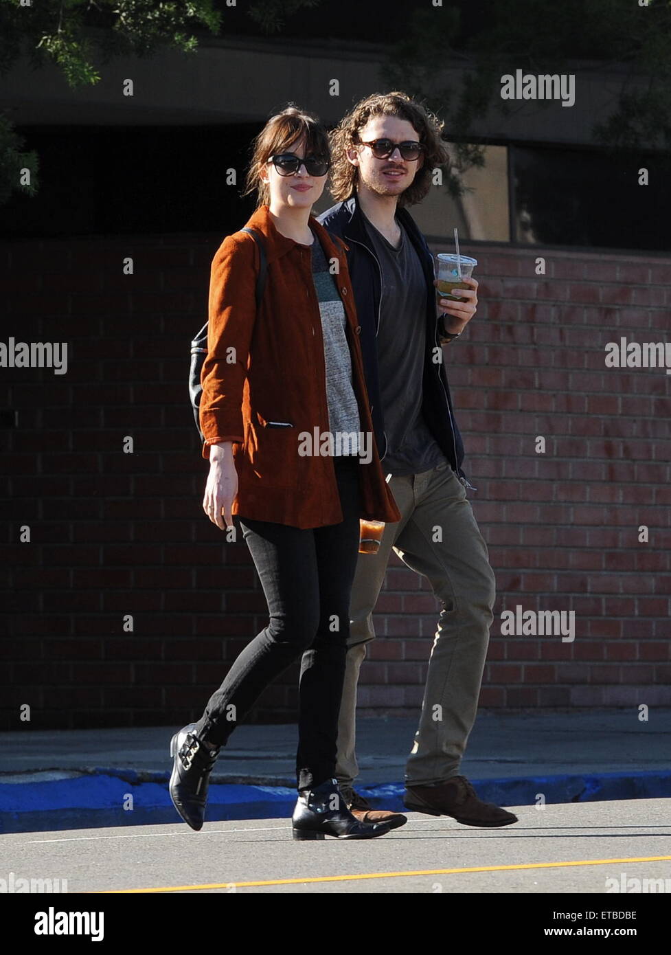 'Fifty Shades of Grey' star Dakota Johnson is all smiles after picking up her dry cleaning in Los Angeles. Afterwards, the actress headed out for lunch to Homestate cafe with a male friend  Featuring: Dakota Johnson Where: Los Angeles, California, United States When: 14 Jan 2015 Credit: Cousart/JFXimages/WENN.com Stock Photo