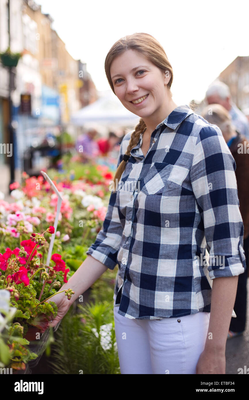 young woman at the flower market Stock Photo