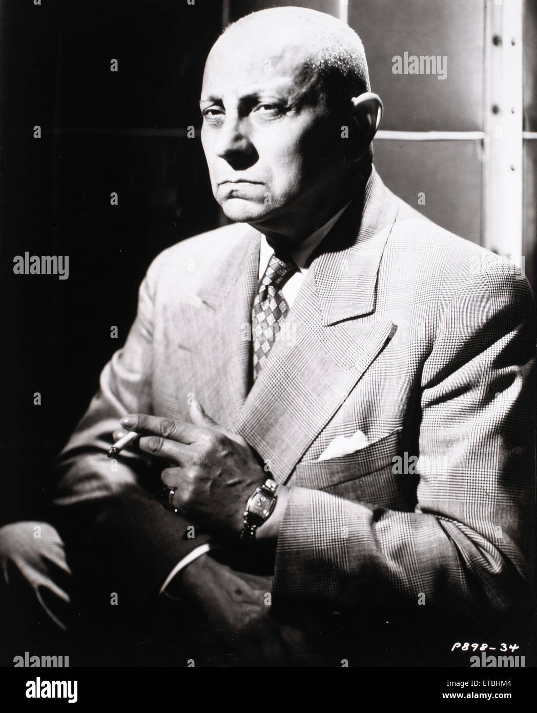 Erich von Stroheim, Portrait Smoking Cigarette on-set of the Film 'Sunset Boulevard', 1950 Stock Photo