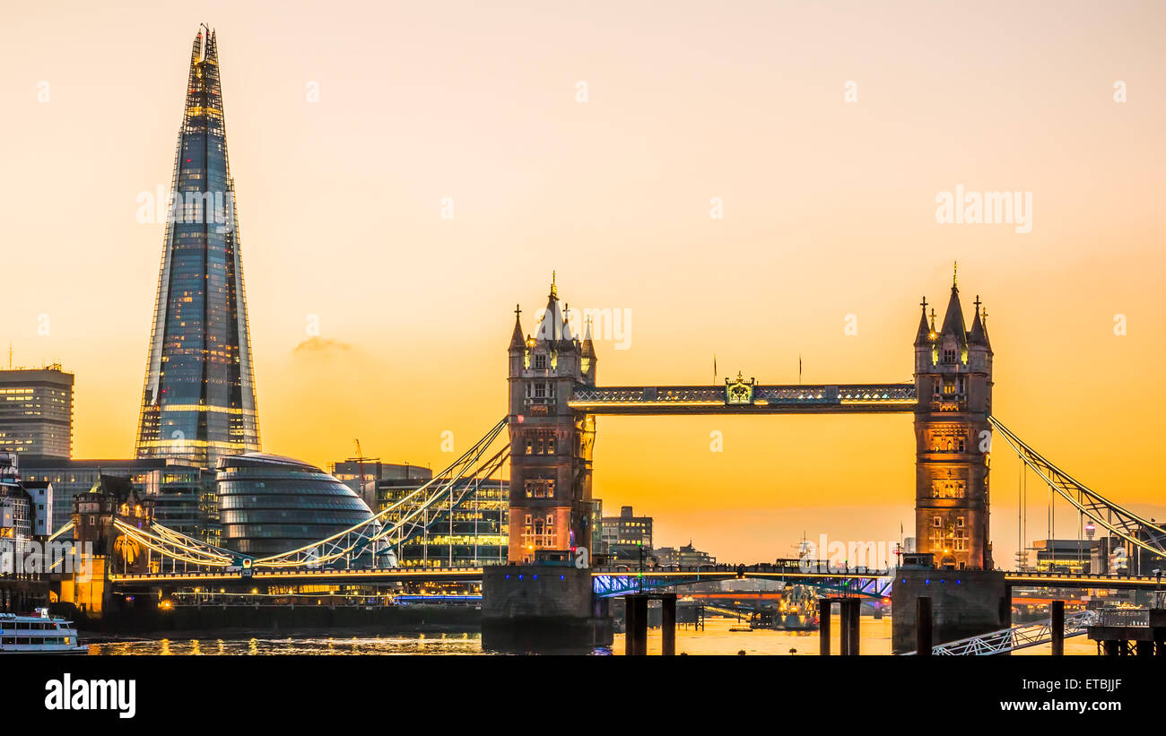 The new London skyline with Tower Bridge and the new The Shard skyscraper at Dusk. Stock Photo