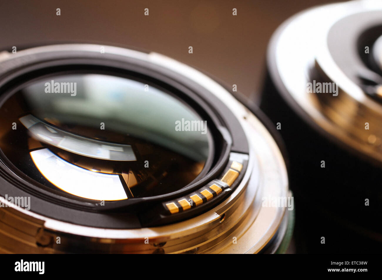 a Closeup macro image of a zoom SLR Prime lenses showing the lens glass and metal connectors