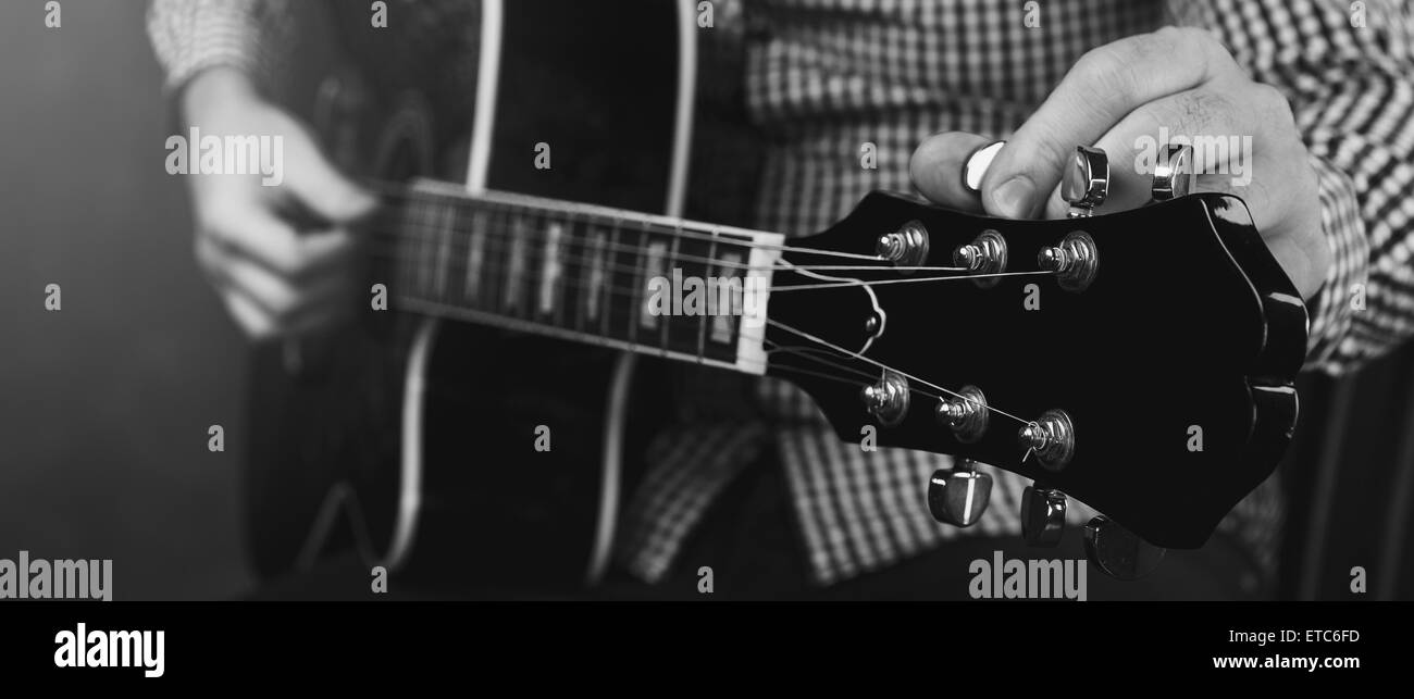 acoustic guitar tuning and playing close up Stock Photo Alamy